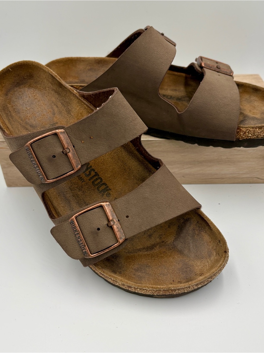 Birkenstock Arizona Two-Strap Sandals in Brown with Copper Buckles